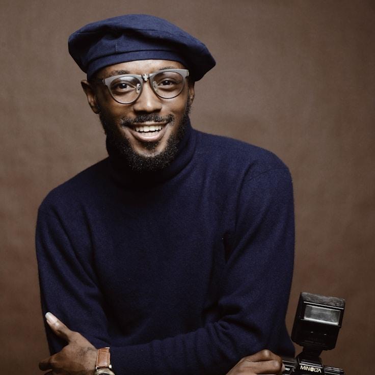 Kaveri Mehta, Lead Design Curator at CloudHavenPress, reviewing corporate floral arrangements